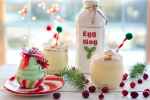egg nog bottle near cupcake red berry fruits and ice cold drinks