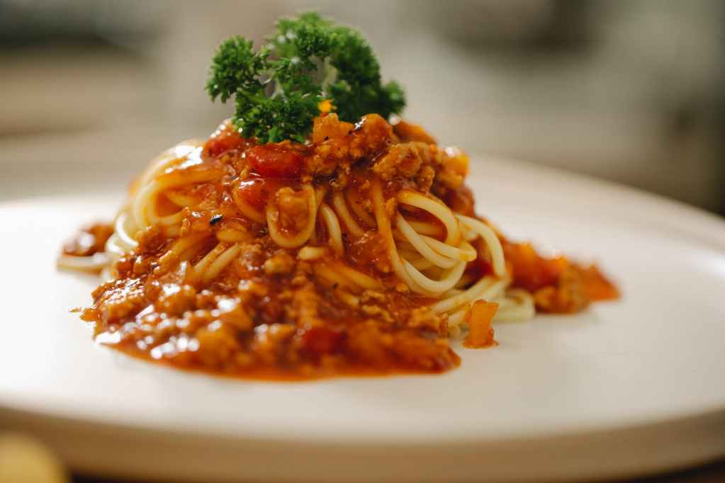 appetizing pasta bolognese served with parsley