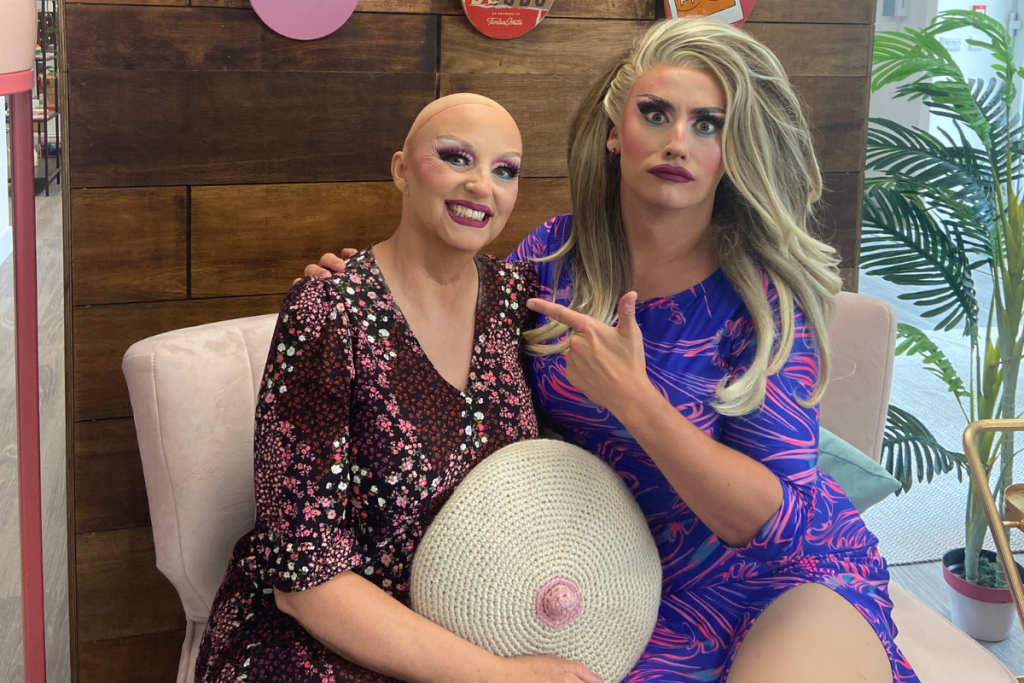 A photo of Ella in full drag and her mum in semi drag with makeup on after discussing Breast Cancer with CoppaFeel!